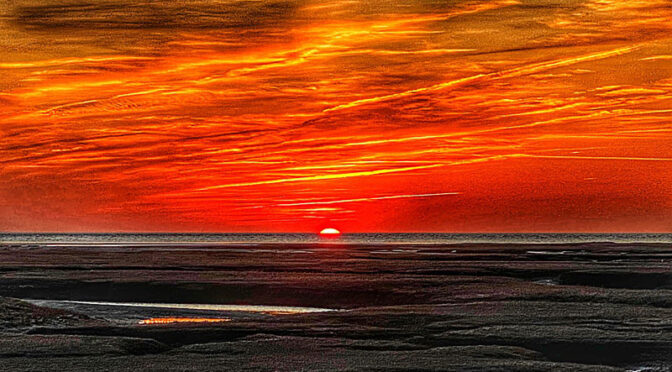 Orange Sunset Over The Salt Marsh On Cape Cod.