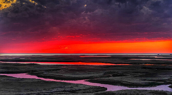 Fiery Sunset Over The Salt Marsh On Cape Cod.
